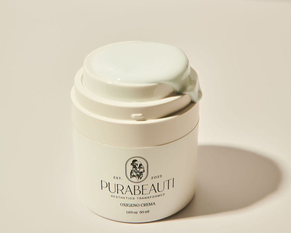 A white jar with a pump dispenser labeled Purabeauti Oxigeno Crema on a neutral background. anti-aging peptide acne safe moisturizer
