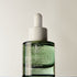 A glass bottle with a dropper containing the product 'Purabeauti Aquacalm', labeled for soothing, healing skin,and acne safe