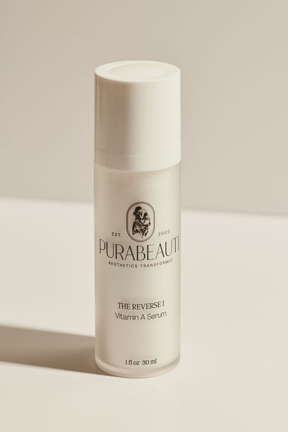 A white bottle with a pump dispenser labeled &
