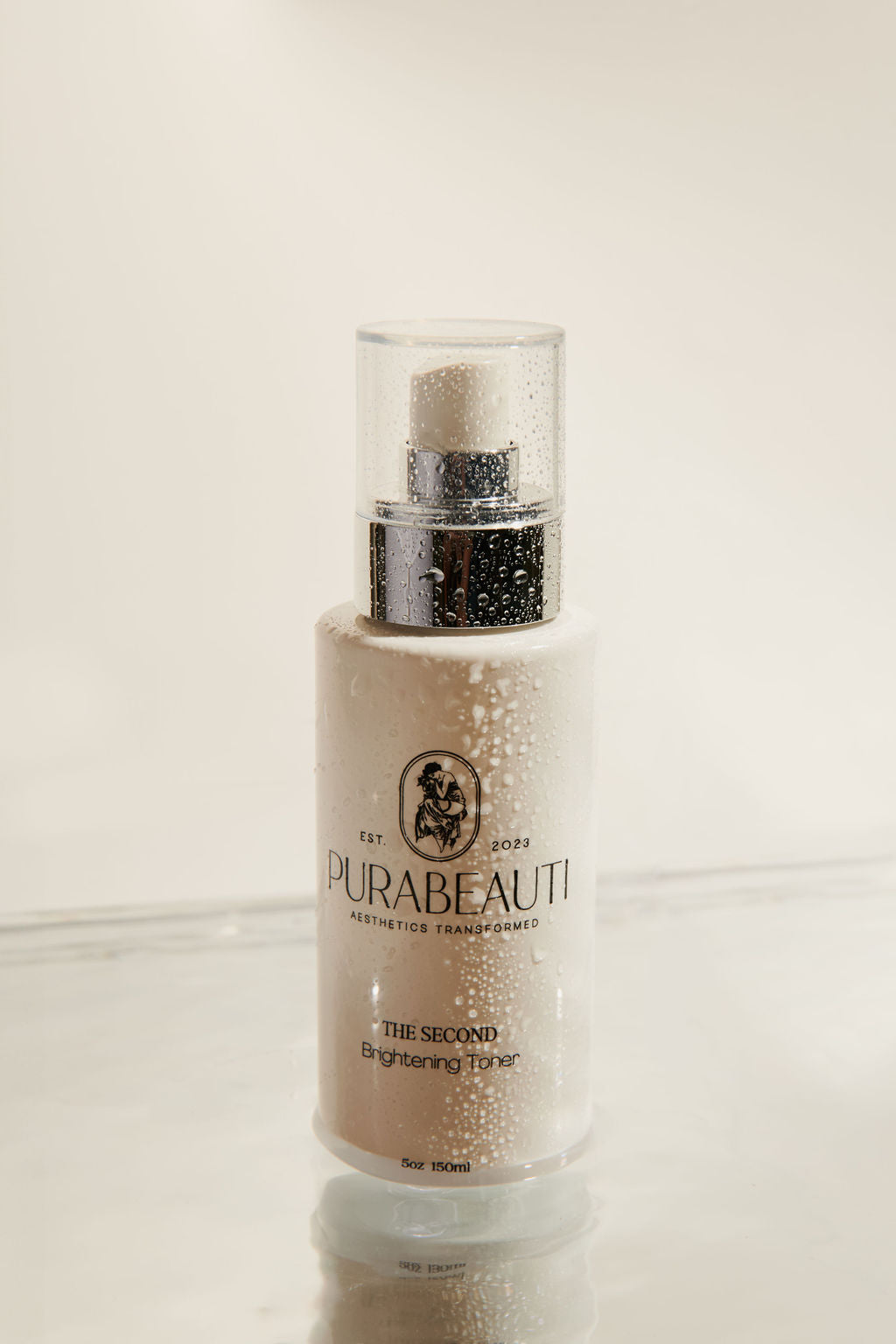 A pump bottle of a facial toner labeled  The Second by Purabeauti